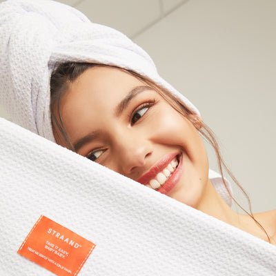 Brand model holding mirofiber hair towel