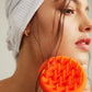 Model wearing the MicroFibre Head Towel and holding the Scalp Scrubber